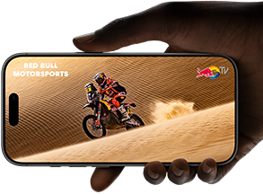 A hand holds an iPhone 17 Pro, Silver, horizontal, video playback on all-screen display demonstrating battery life